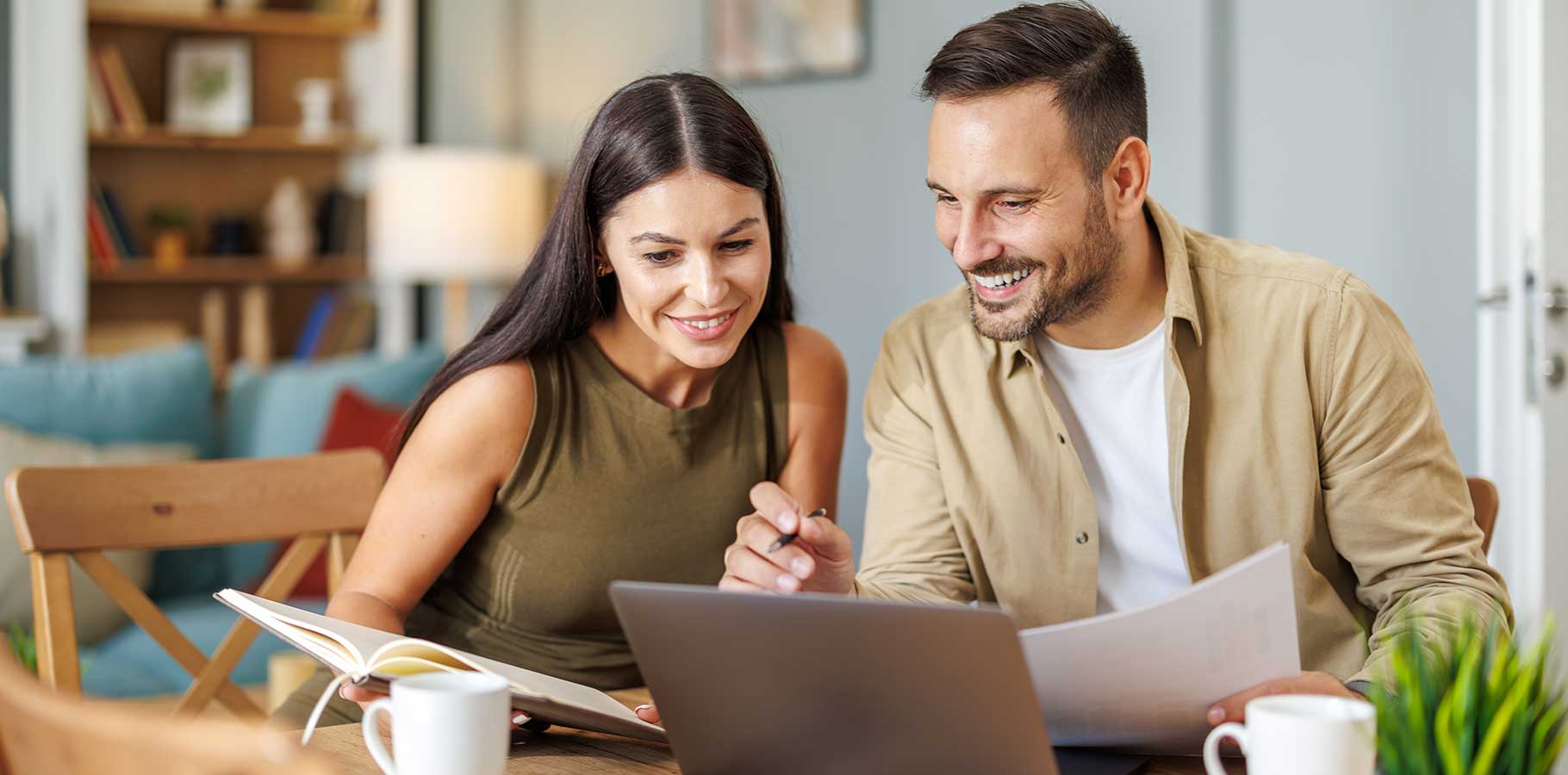 Couple reviewing their new build documents at home