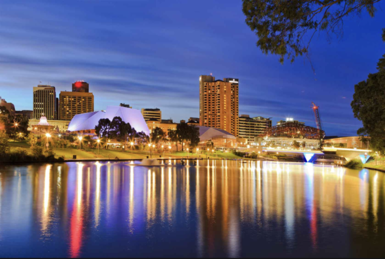 Adelaide city skyline at night reflected in the river